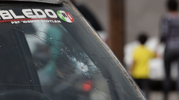 A bullet punctured the windshield of a vehicle in the community of Ocotlán, Jalisco, after a March 19 shootout that left 11 people dead. (Photo by Victor Hugo Ornelas/VICE News)